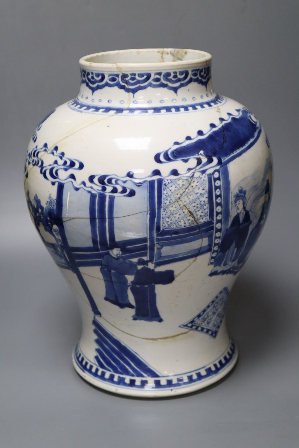 A Chinese Kangxi period blue and white baluster vase, repaired, 35cm